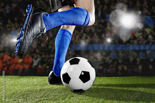 football player in action running and dribbling at soccer stadium playing  match © Wordley Calvo Stock