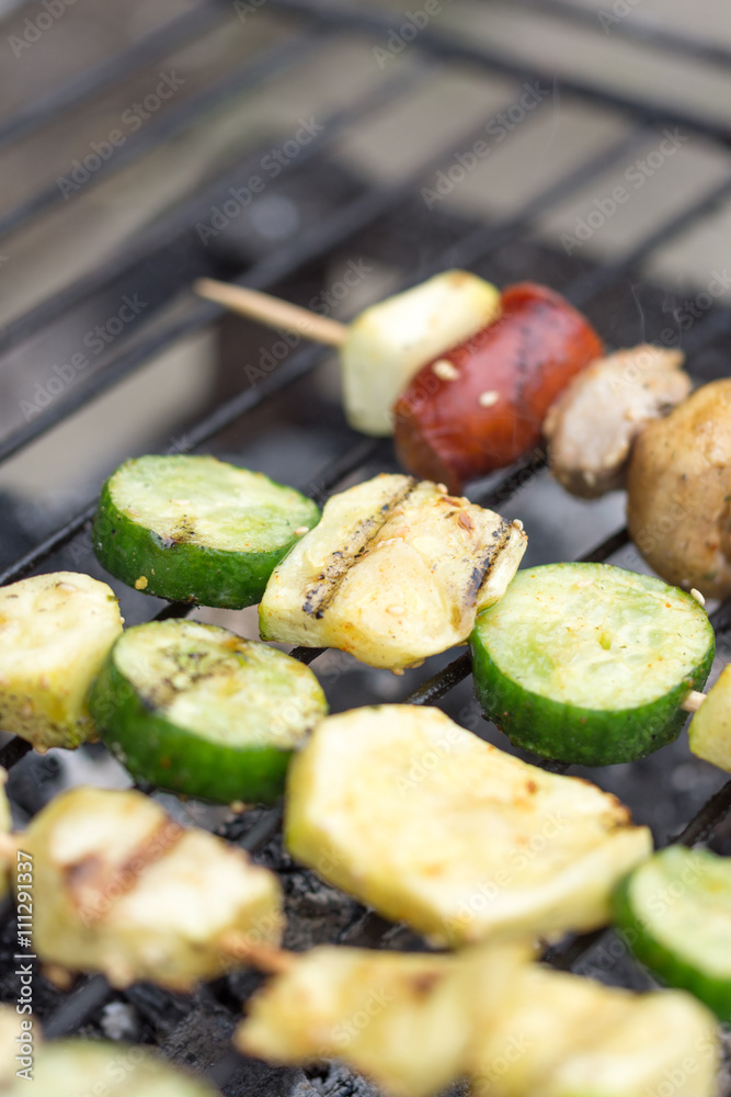 Selective focus on the meat and vegetables on the grill Selective focus on the meat and vegetables on the grill