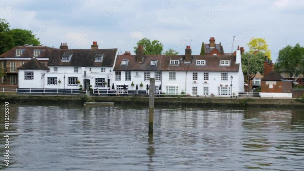 Dolly view of an old riverside pub in west London Dolly view of an old riverside pub in west London