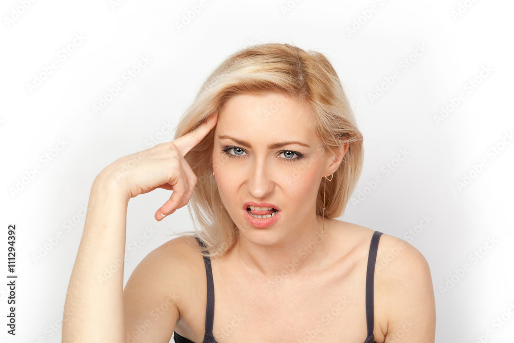 Young attractive blonde woman angry