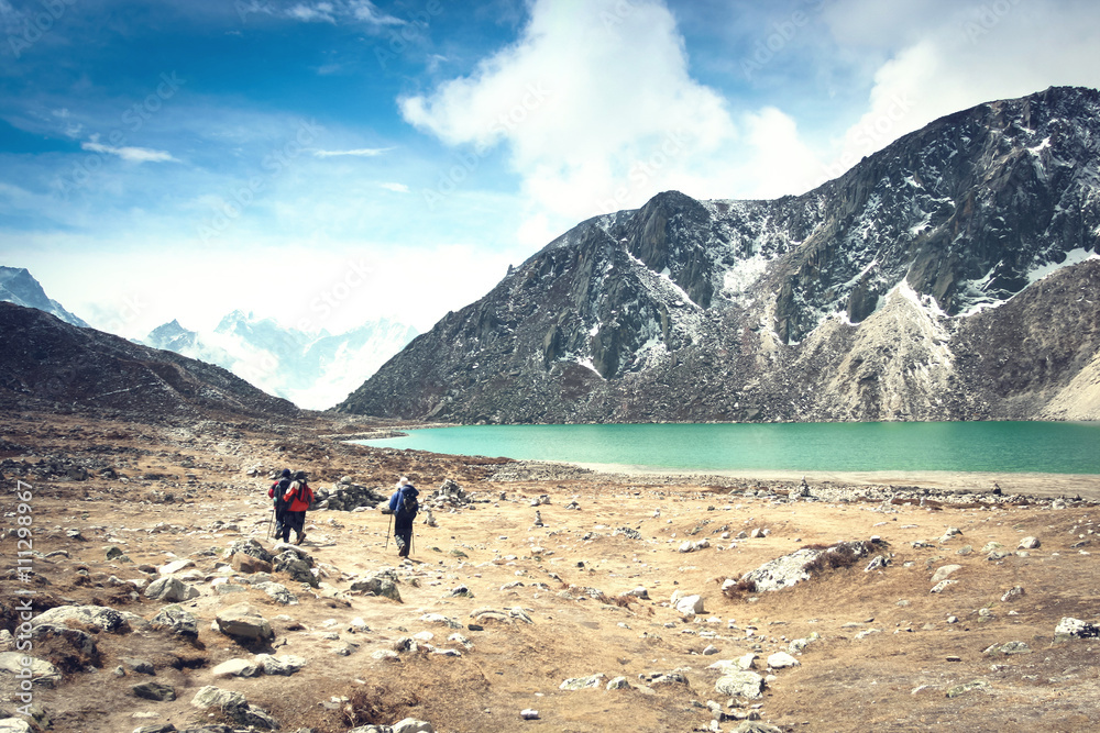 Trekking route on the lake near the village Gokio in Nepal Himalayas