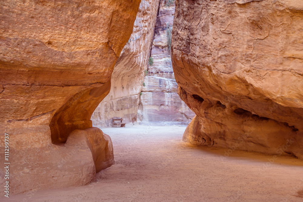 The Siq, the narrow slot-canyon that serves as the entrance passage to the hidden city of Petra, Jordan,  an UNESCO World Heritage Site