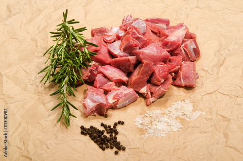 raw deer goulash with rosemary, pepper corn and kosher salt