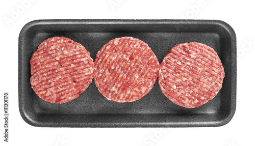 Raw meat patty in package