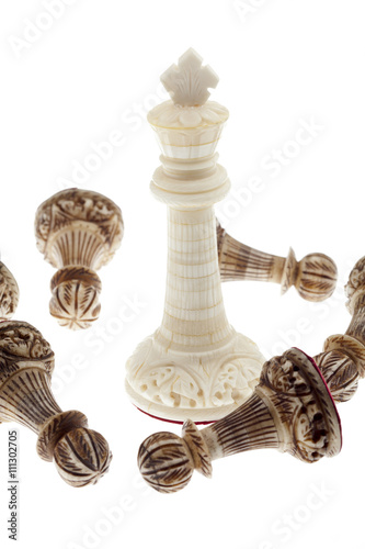 close-up shot of white chess king and pawn lying around.