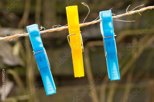 Colored plastic clothes pegs on the clothesline.
Cheerful colors.