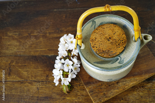 Japan's teapot with sakura flowers photo