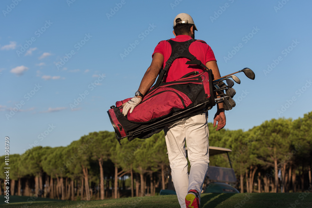 golfer walking and carrying golf bag golfer walking and carrying golf bag