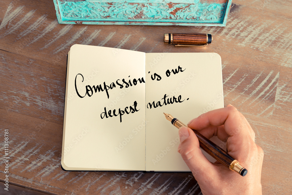 Handwritten quote Compassion is our deepest nature as inspirational concept image