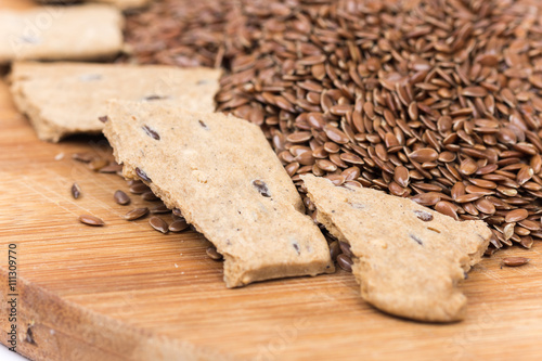 Flax seeds with flax snacks on the board