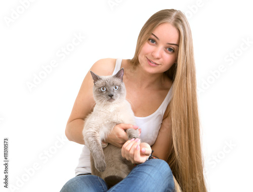 beautiful young woman with a cat on a white background
