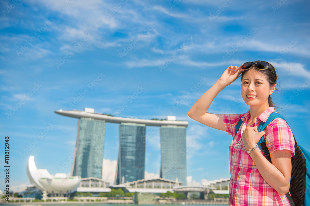 Happy Asia woman Travel in Singapore, Marina Bay Sands Hotel