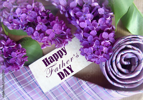 Beautiful purple lilac and tie for father's day. Greeting card. Abstract concept background for father's day celebration
