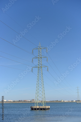 Power lines in the water at the harbor on tunis