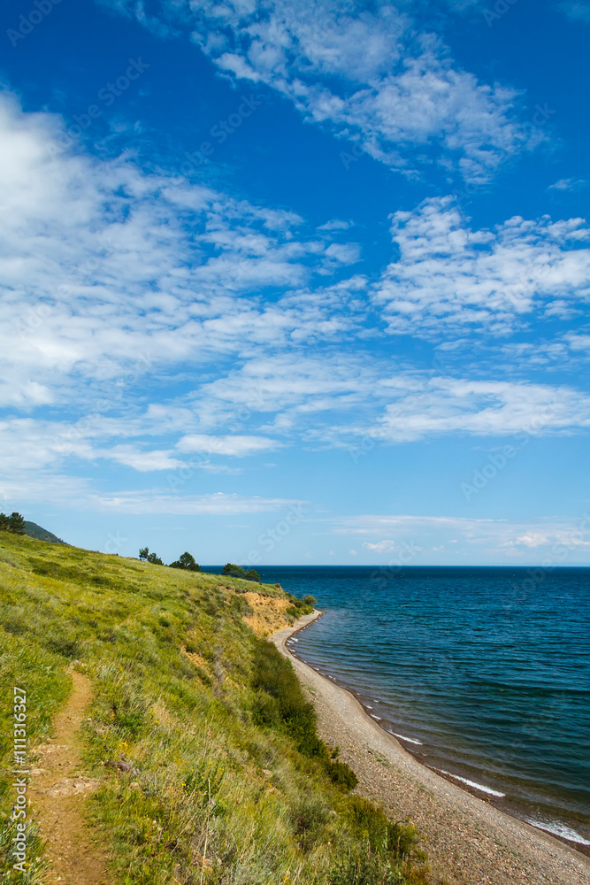 Small trekking path at Baikal lake with blue skies