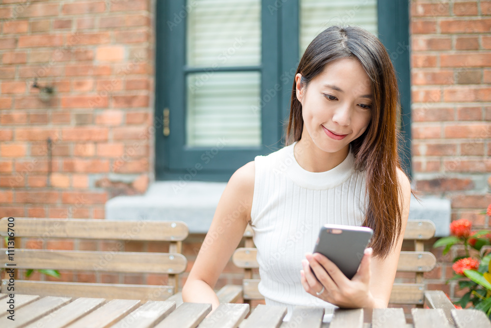 Woman look at mobile phone Woman look at mobile phone