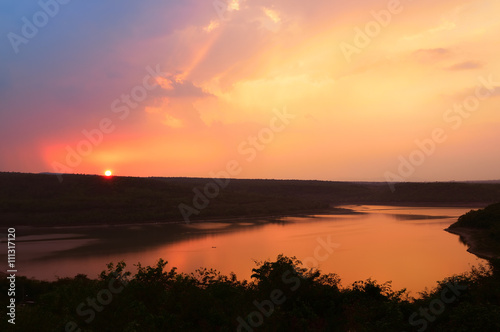 Beautiful sunset over lake at Lam Ta Khong Reservoir © Salawin Chanthapan