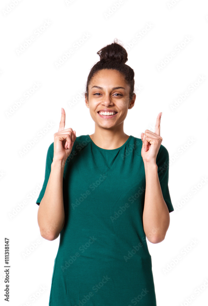 Beautiful young african woman pointing up and smiling Beautiful young african woman pointing up and smiling