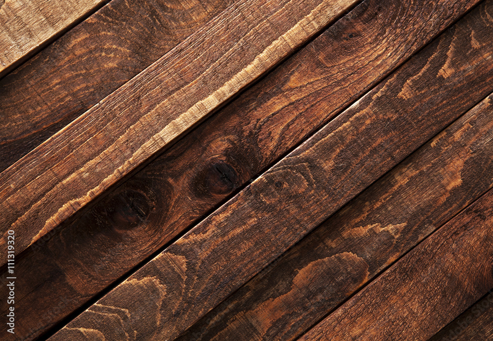 Fototapeta premium Dark wooden texture. Diagonal background brown old wood planks.