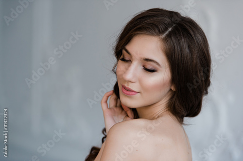 Wallpaper Mural Close portrait of beautiful smiling bride woman with long curly hair posing in wedding dress at interior and smiling. Beauty indoor portrait. Torontodigital.ca