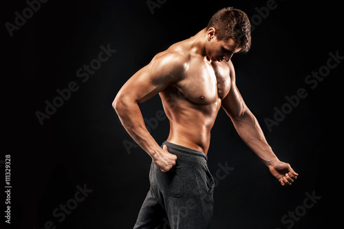 Image of very muscular man posing with naked torso © nazarovsergey