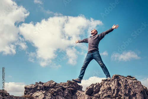 Man enjoy with freedom feel on the top of mountain