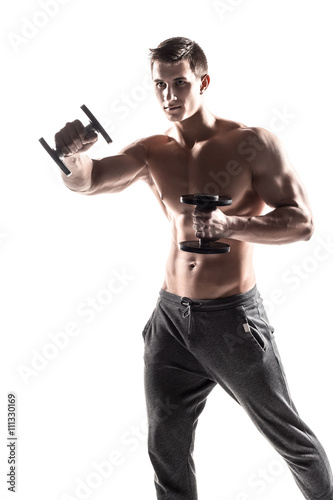 Muscular man doing exercises with dumbbells isolated on white background