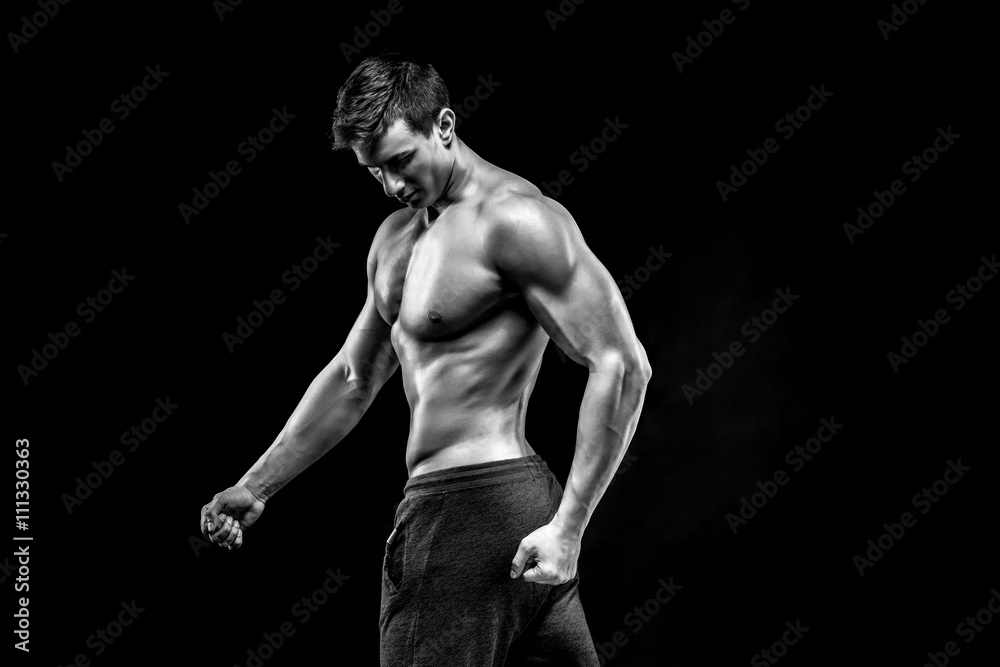Image of very muscular man posing with naked torso Image of very muscular man posing with naked torso