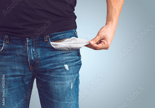 Man in jeans with empty pocket photo