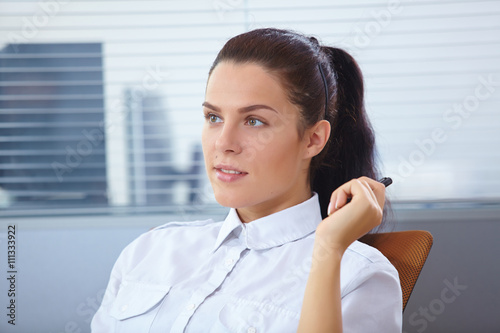 Young businesswoman sitting at workplace Free Download Young businesswoman sitting at workplace - GFXLoad