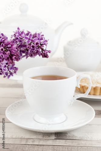 Composition of white porcelain cup of tea