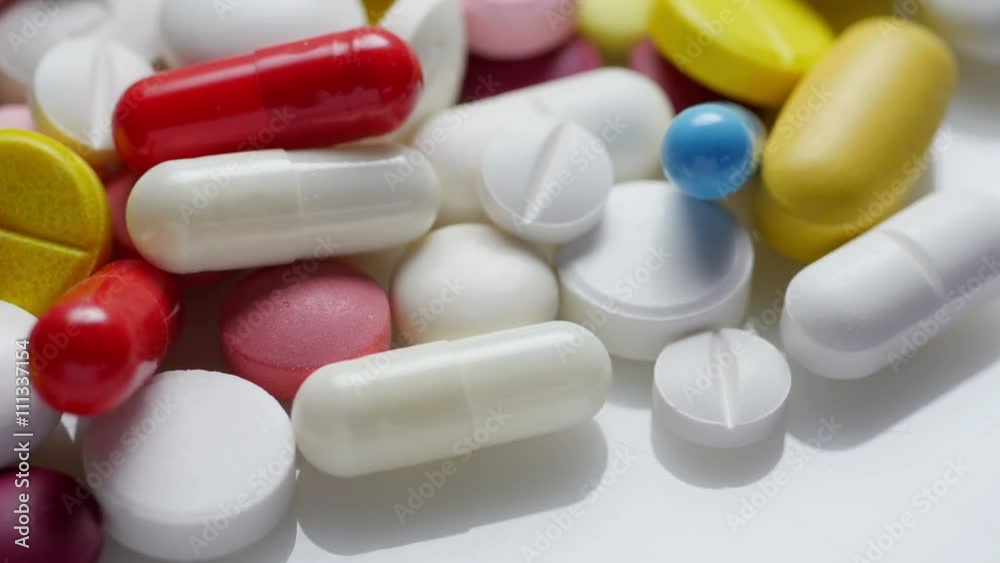 Medicine and Drugs. Many pills tablets and capsules turning. Medicine and Drugs. Many pills tablets and capsules turning.