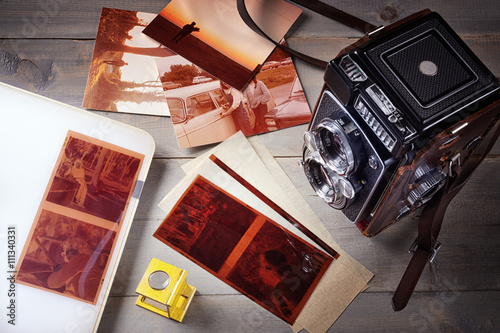 Old camera with photos, films and negative viewer photo