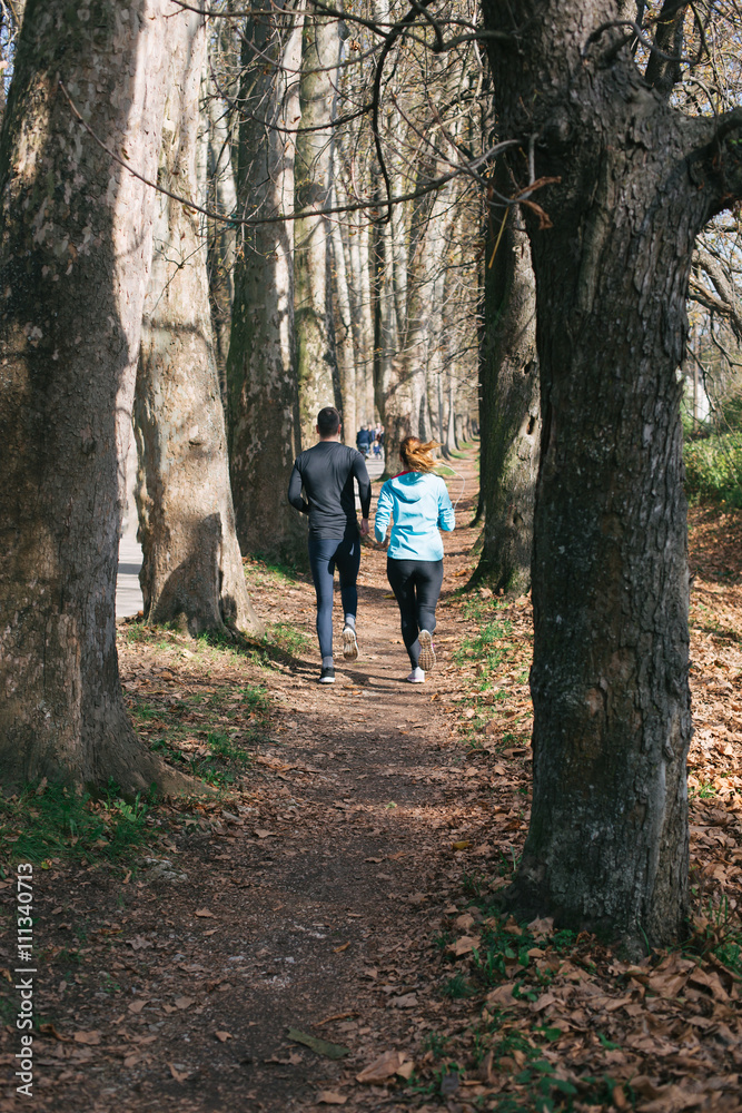 Trail running marathon athlete outdoors sunrise couple training Trail running marathon athlete outdoors sunrise couple training
