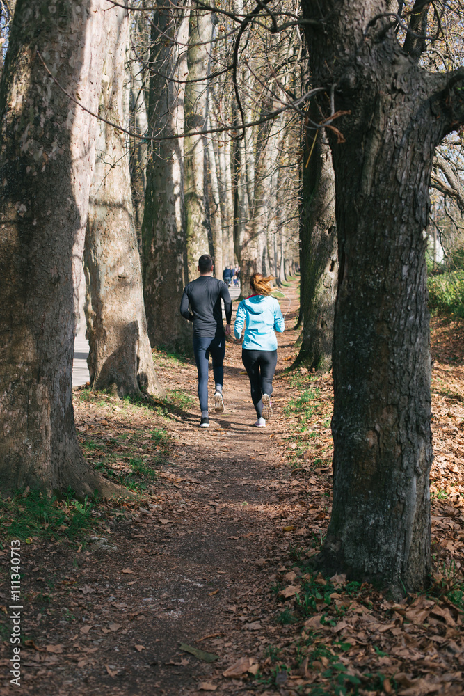 Trail running marathon athlete outdoors sunrise couple training