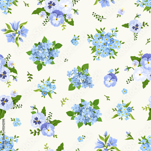 Vector seamless pattern with blue pansies, bluebells, plumbago and forget-me-not flowers.