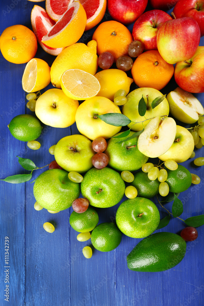 Fruits on dark blue wooden background Fruits on dark blue wooden background