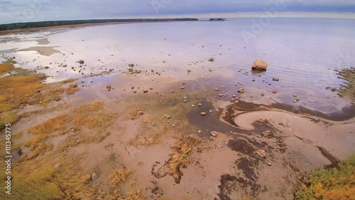 Closer look of the rocky shore in Altja the big ocean fronting the forest one of the toursist destination in Lahemaa National Park photo