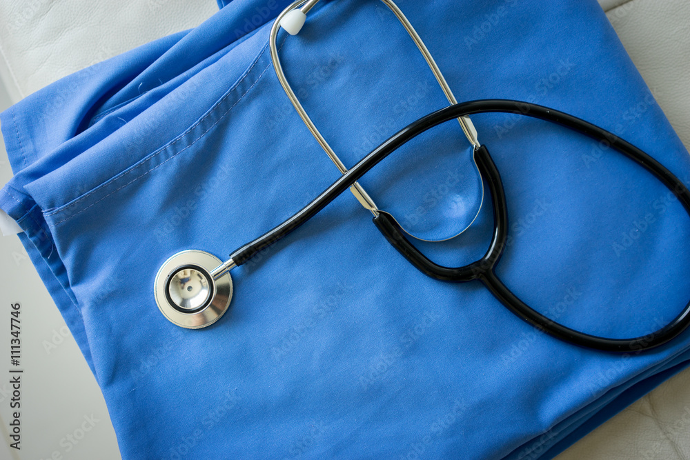 Stethoscope on nurse & doctor coat background Stethoscope on nurse & doctor coat background