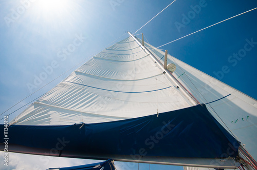 Sailing yacht in a smooth wind with sunny blue sky day