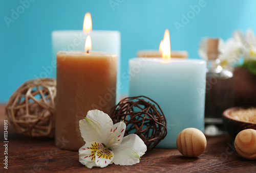 Spa set  soft towel  flowers  massage oil  candles  sea salt  close up