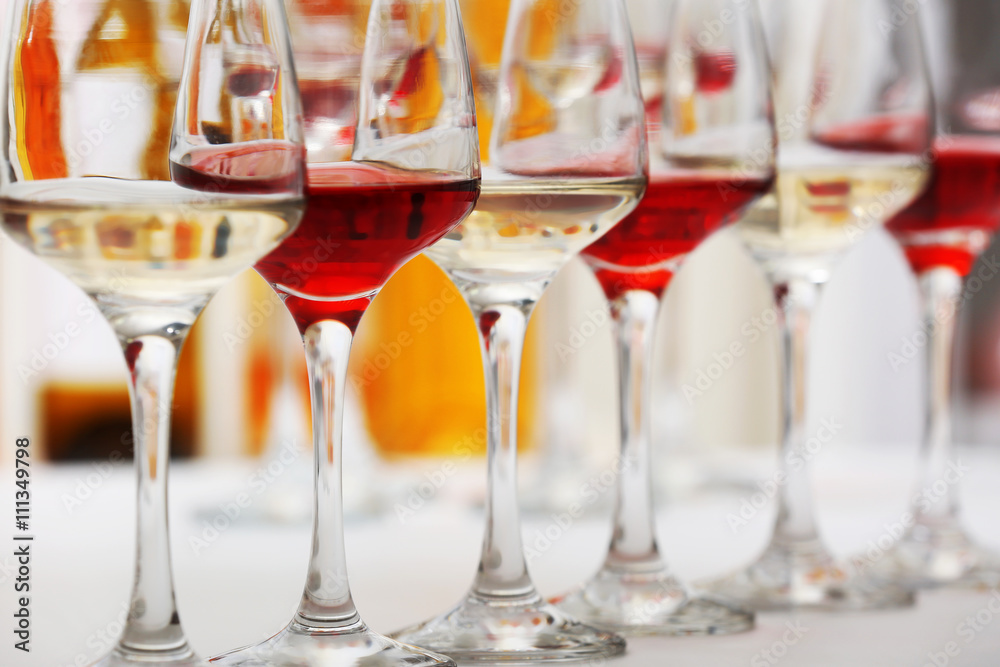 Wine glasses with red and white wine, closeup Wine glasses with red and white wine, closeup