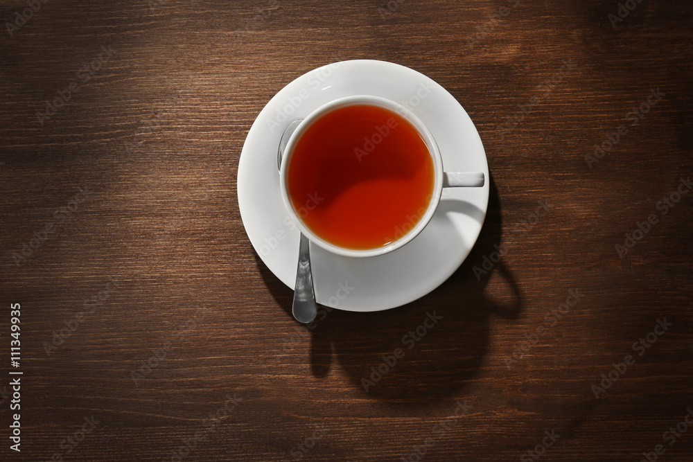 Obraz premium Cup of tea on wooden table