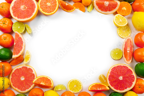 Fresh mixed citrus fruit including   lemons  limes  grapefruits  oranges and tangerines with slices  isolated on white background  top view