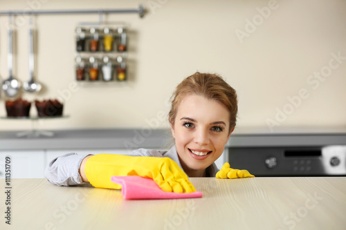 Young woman scrubbing the b...