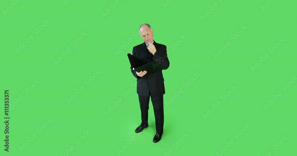 Senior caucasian business man green screen worried with binder Senior caucasian business man green screen worried with binder