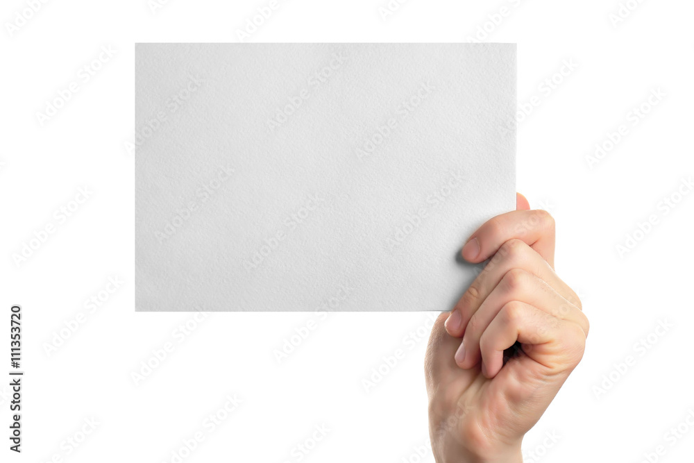 Obraz premium Male hand holding clean sheet of paper, isolated on white