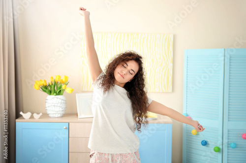 Girl stretching after wake up
