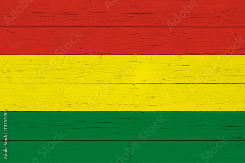 Flag of Bolivia on wooden background