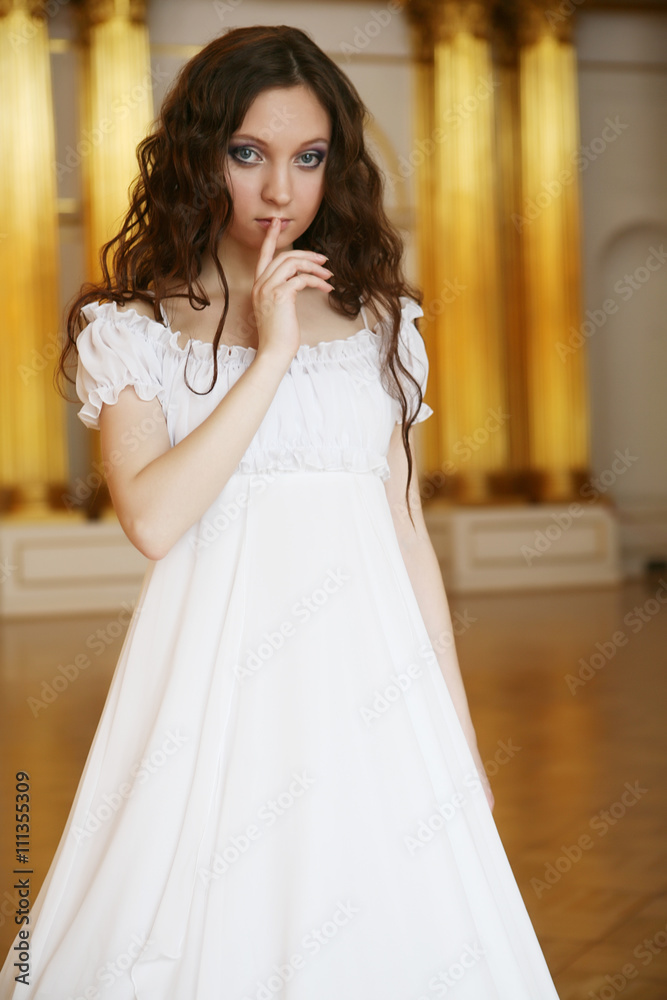Portrait of a beautiful young victorian lady in white dress Portrait of a beautiful young victorian lady in white dress